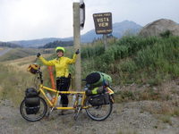 GDMBR: Terry Struck and the Bee at the Vista View of Togwotee Pass (at the top of the hill in this picture), Grand Teton National Forest, Wyoming.